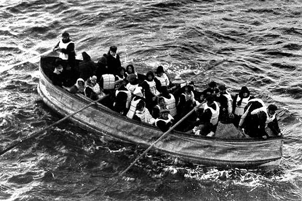 Titanic collapsible lifeboat D approaching the rescue ship Carpathia.