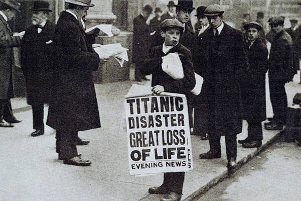 Newspaper seller Ned Parfett advertises that day's dramatic headline, 'Titanic Disaster Great Loss Of Life', outside the White Star Line offices in London, 16 April 1912.
